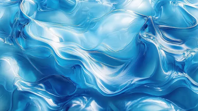 Close-up of translucent blue liquid waves with rippling texture and light reflections