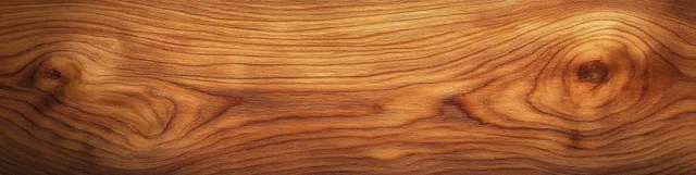 Close-up of cherry wood plank showing warm grain patterns and knots under soft light.