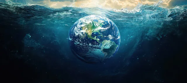 Earth is shown floating underwater beneath crashing waves with bright blue-green lighting.