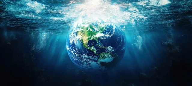 Glowing Earth floats underwater as light rays beam through the ocean and green sea life surrounds it.
