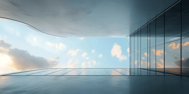 Curved glass and steel skyscraper exterior reflects sunset sky across tall windows and panels.