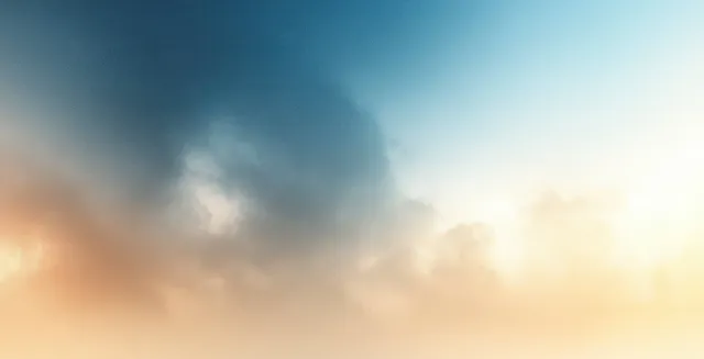 Soft pastel blue and beige abstract gradient sky-like background with gentle haze glow