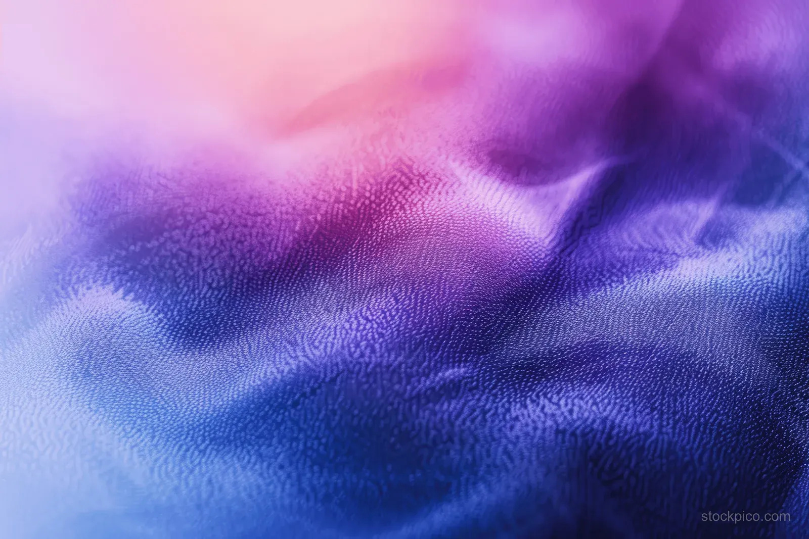 Blue and purple abstract gradient with grainy watercolor texture and soft flowing blur.