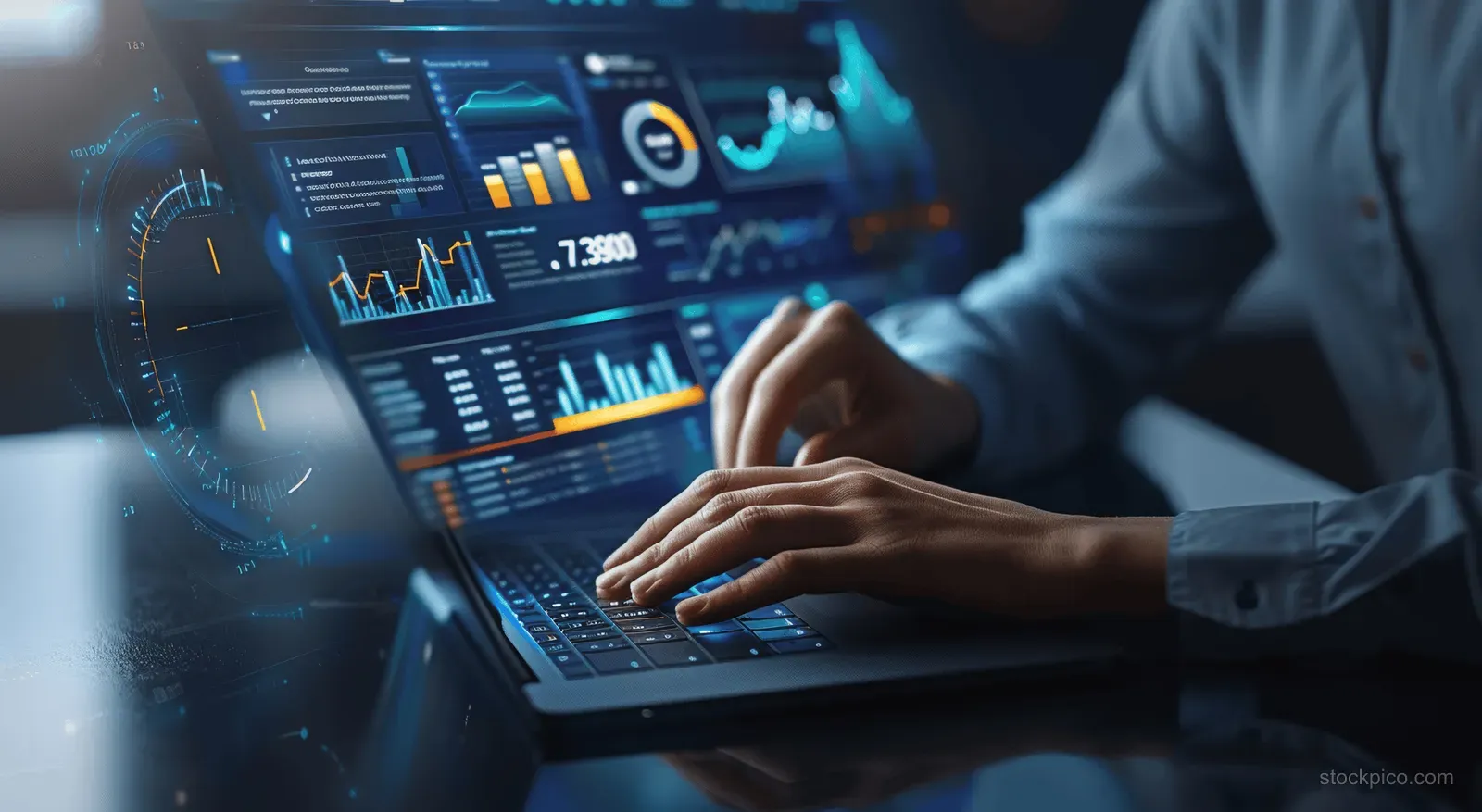 A business analyst’s hands type on a laptop showing glowing real-time sales dashboard charts and KPIs.