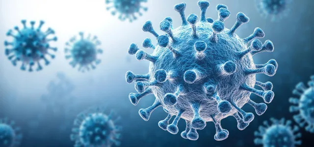 Blue 3D coronavirus particles floating against a hazy medical background