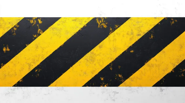 Worn yellow and black diagonal hazard stripes with chipped paint on a textured surface against a white background.