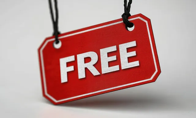 Red promotional price tag reading FREE with white border hangs from two black strings on a gray background.