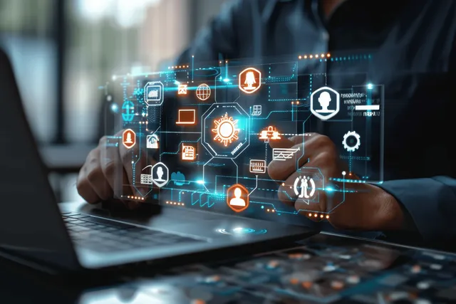 A businessman uses a laptop while holographic icons and a handshake partnership overlay appear on the screen.