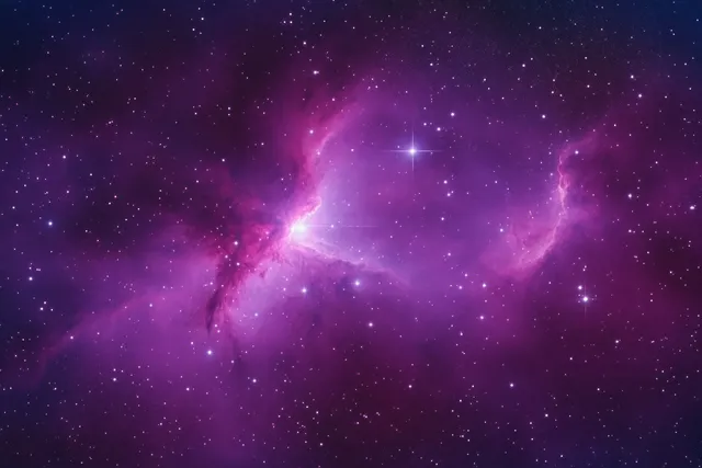 Purple and pink nebula with scattered bright stars across a dark deep-space background.