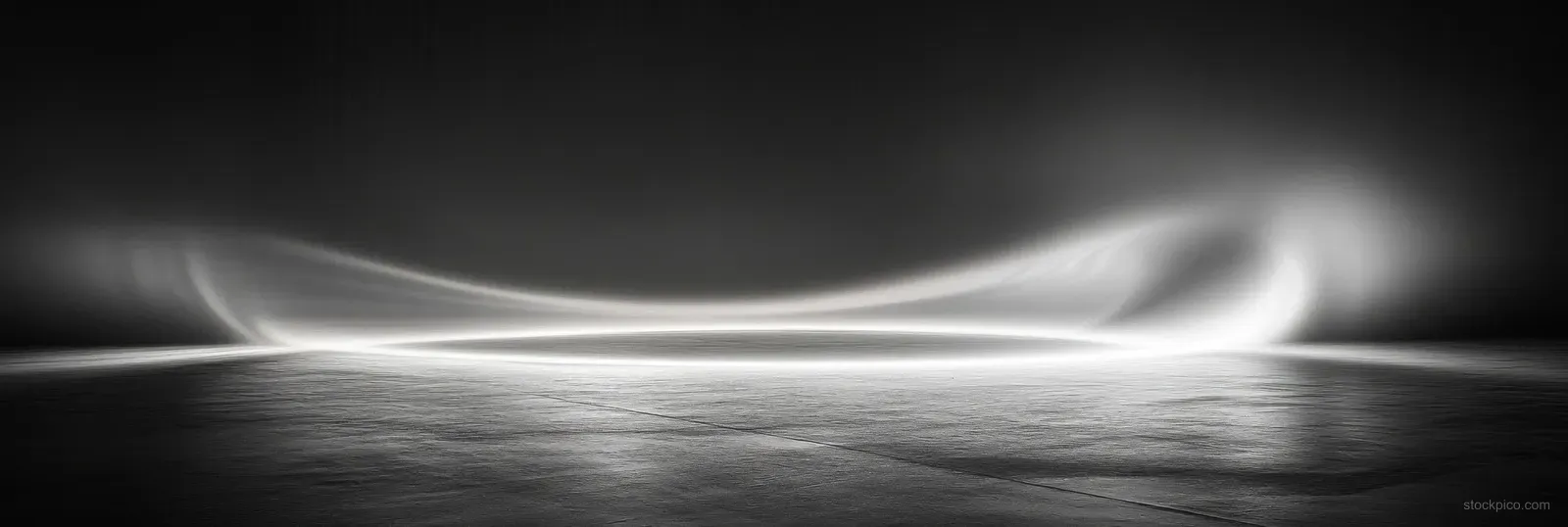 Monochrome light wave ribbons sweep horizontally above a textured reflective surface with a soft vertical gradient.