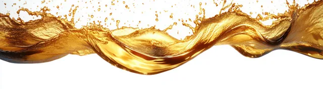 Golden liquid splash flowing over a white background with droplets suspended and bright glossy highlights.