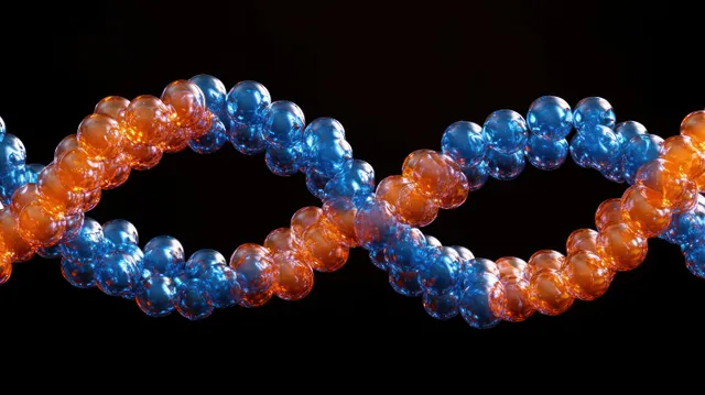 Close-up of a glossy blue and orange DNA double helix made of spherical molecules on a black background.