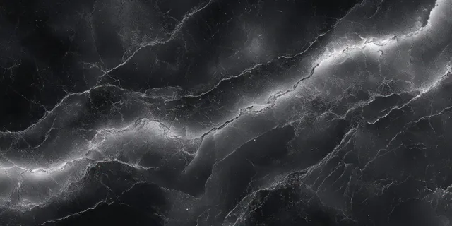 Seamless black and white marble texture with swirling stone veins and soft highlights