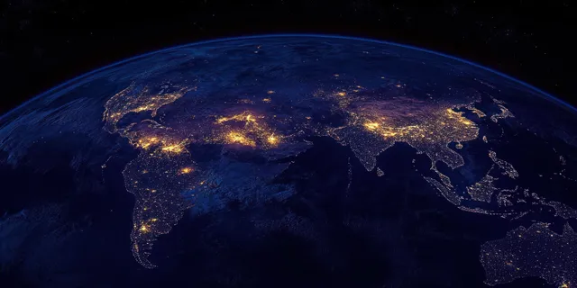 Earth at Night with City Lights Across Continents in Space