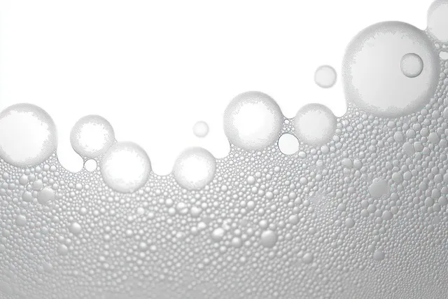 Transparent soap bubbles clustered in a wave-like texture against a white background.