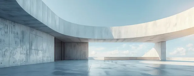 Minimal concrete open space with curved white wall and blue sky horizon