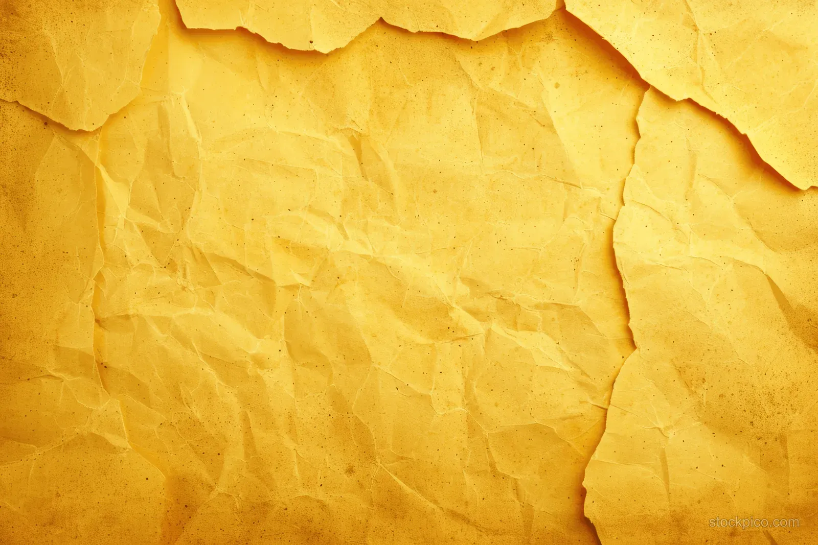 Sunlit yellow concrete wall texture with crumpled paper layers, cracks, and rough grain.