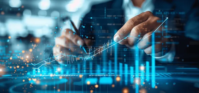 Business analyst sketching upward growth arrow on glowing financial dashboard