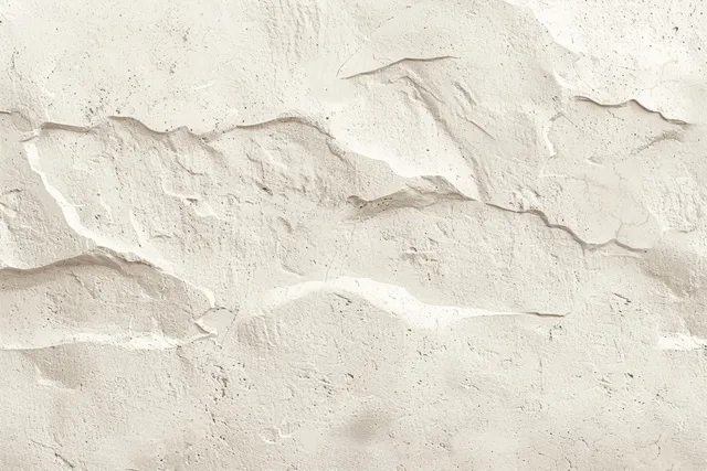 Cream plaster concrete wall closeup with sand and stone texture, shallow cracks, and uneven surface shadows.