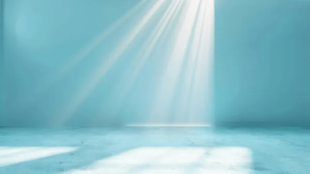 Light blue abstract background with sun rays and spotlight beam over empty floor space