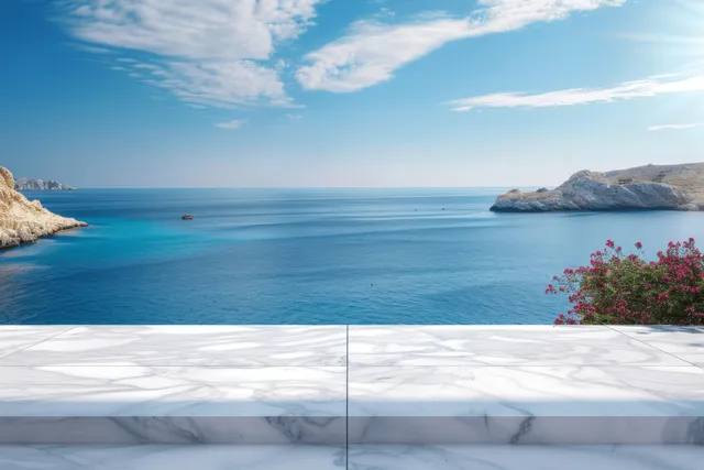 Marble tabletop with calm blue sea and sky over Greek island
