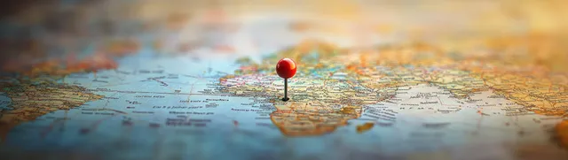A red pushpin marks a location on a map focused on the Gulf of Guinea and surrounding coastlines.