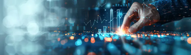Hand placing a marker on a digital finance chart during investment planning