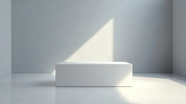 A rectangular white platform sits in an empty white room as soft daylight casts sharp geometric shadows on a reflective floor.