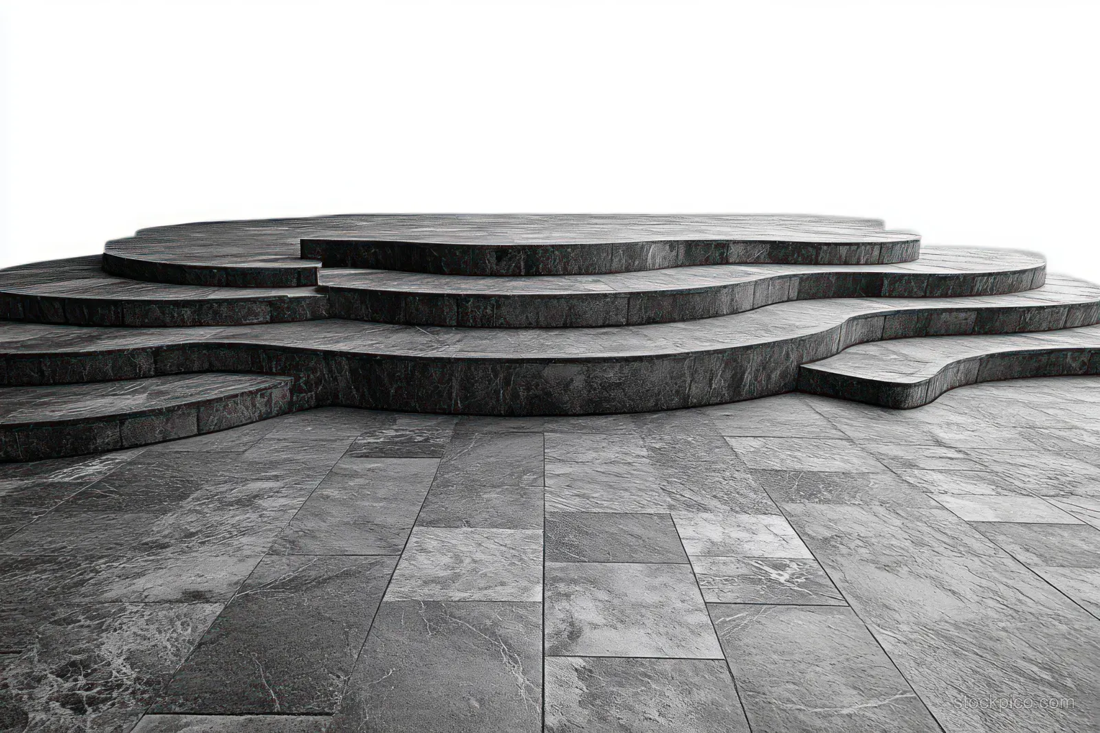 Gray stone platform with curved, layered steps and textured surfaces against a clear white background.