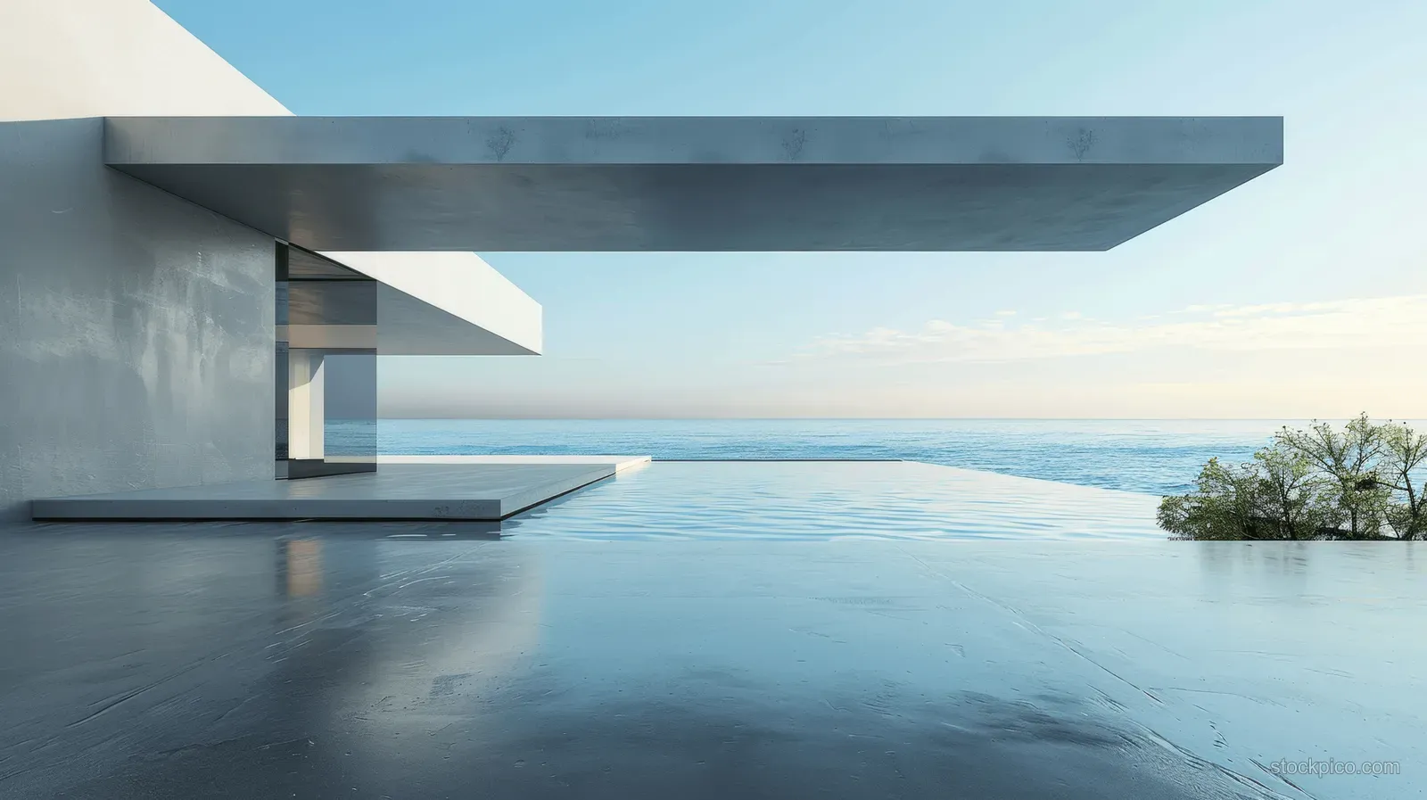 Minimalist concrete terrace with cantilever overhang overlooking a calm sea under a bright sky.