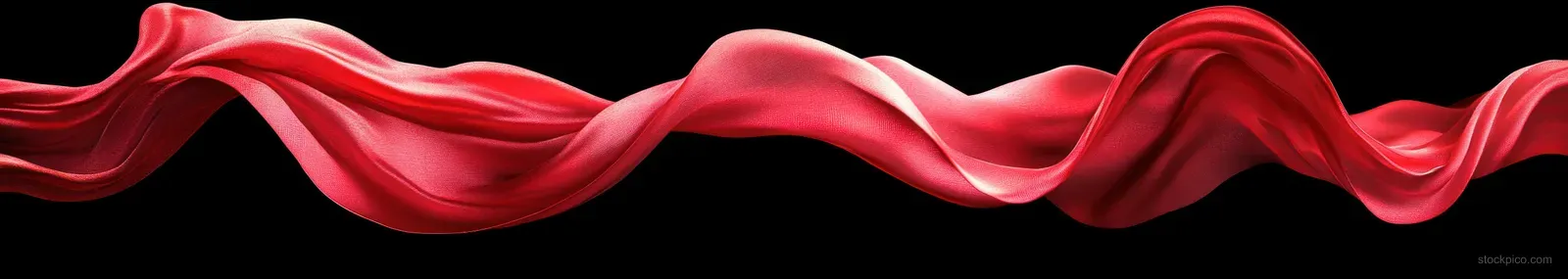 Red fabric wave with smooth flowing folds swirls across a dark black background.