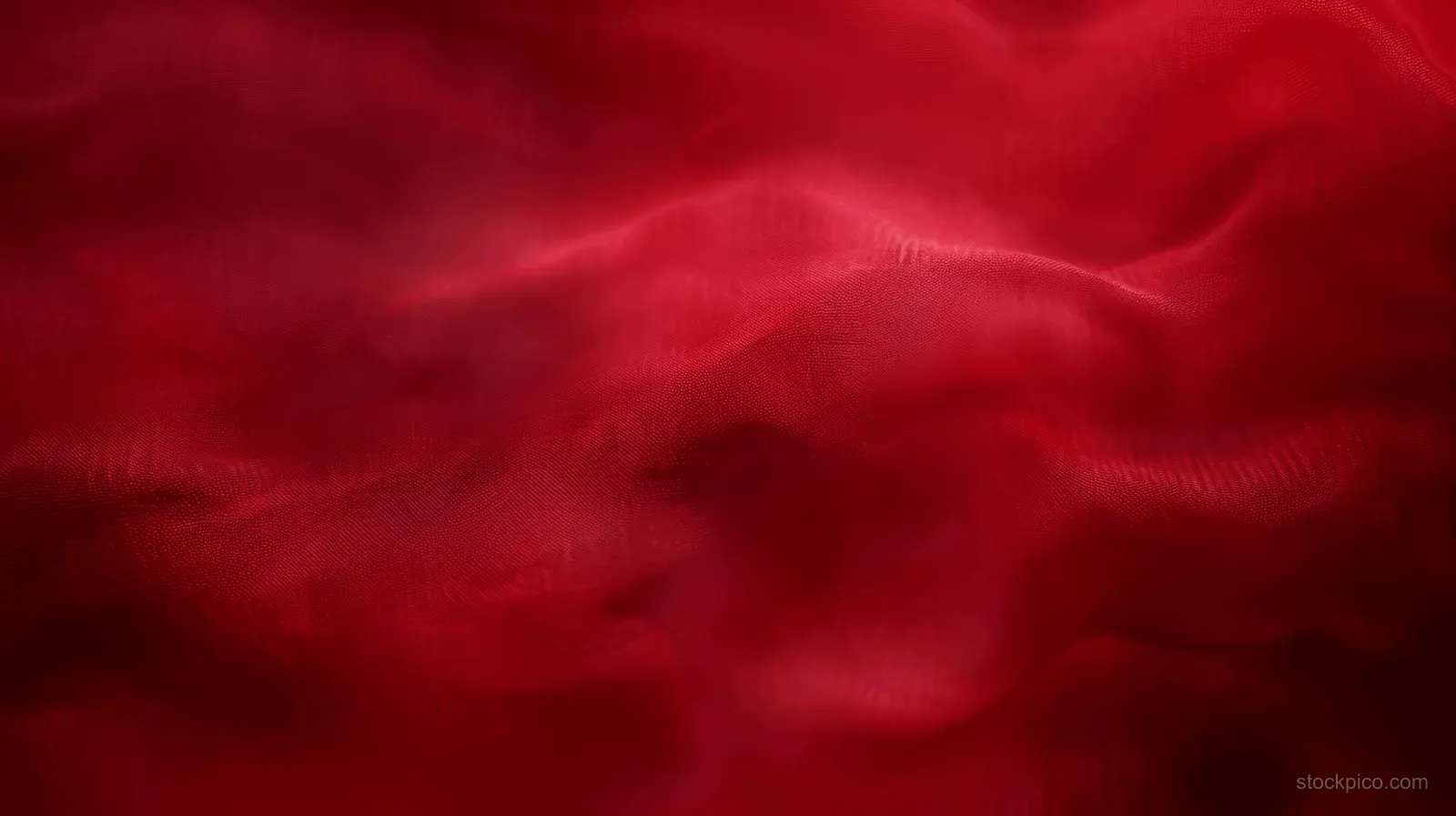 Dark red blurred velvet gradient background with soft smoky folds and flowing fabric texture.
