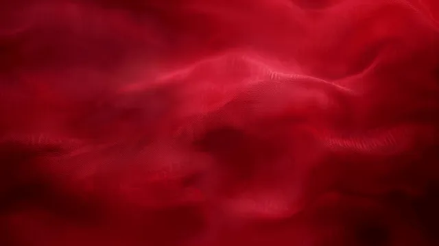 Dark red blurred velvet gradient background with soft smoky folds and flowing fabric texture.