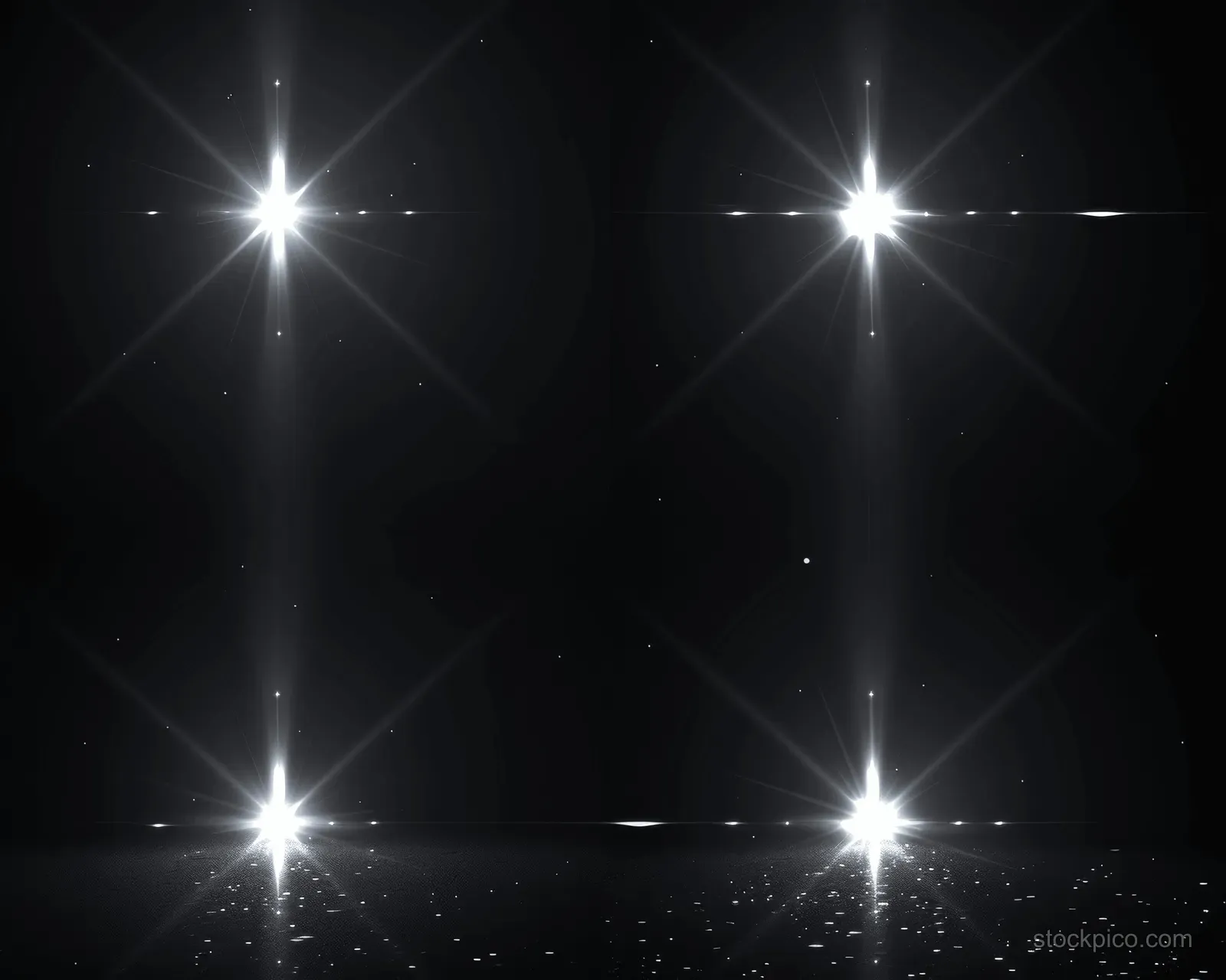 White starburst lens flares intersect on a black background with sharp light rays and tiny sparkles.