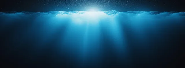 Blue spotlight glow above dark grainy gradient background with light rays